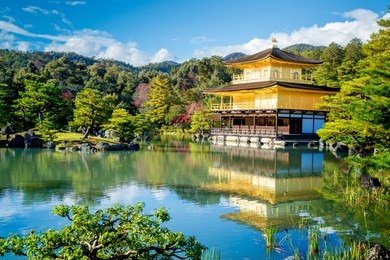 kyoto travel to kinkakuji temple or golden pavilion (kinkaku-ji) in kyoto, japan on november end of autumn season.