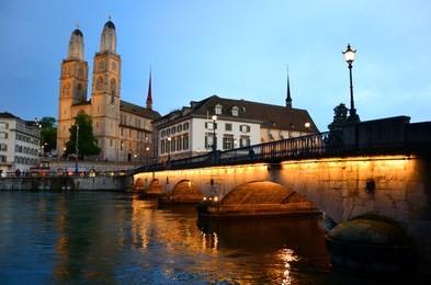 munsterbrucke and grossmunster church in river limmat, zurich, switzerland