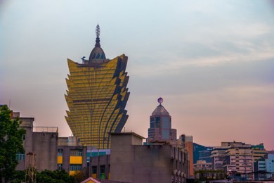 macau, china city skyline at sunset.