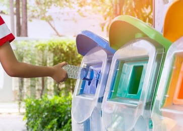 put trash in trash by the classification of garbage. environmental safe concept