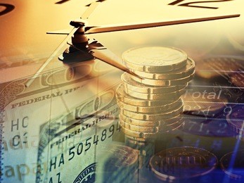 finance background with clock face and money.