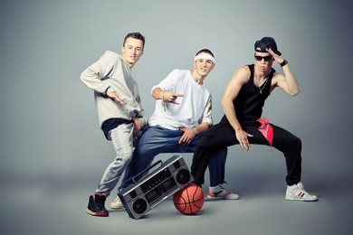 group of trendy teenagers dancing hip-hop at studio.