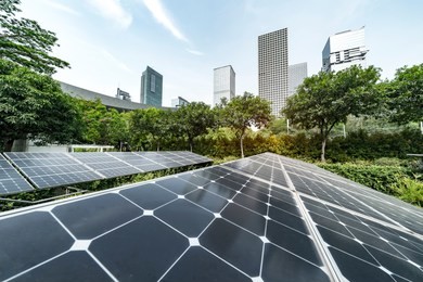 ecological energy renewable solar panel plant with urban landscape landmarks