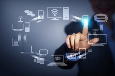 business person pushing symbols on a touch screen interface
