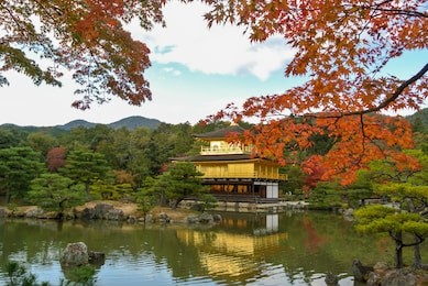 kyoto travel to kinkakuji temple or golden pavilion (kinkaku-ji) in kyoto, japan on november end of autumn season.
