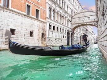 bridge of sighs. traditional venetian transport. gondola floating along the canal in venice. italy