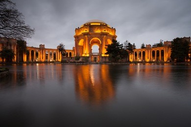 palace of fine arts museum at on a cloudy night in san francisco.