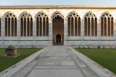 courtyard of campo santo, monumental cemetery in pisa, italy.
