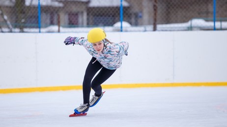 short track sportswoman. speed skating young girl on training rink.