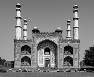 black and white portrait image of south gate entrance to the tomb of great mughal emperor, jalal-ud-din muhammad akbar, at sikandra in agra, uttar pradesh, india