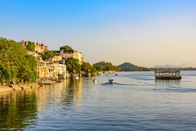 panoramic view of city of lakes udaipur with lake pichola from ambrai ghat,rajasthan, india.