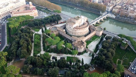 aerial drone view of iconic castel sant'angelo (castle of holy angel) and ponte or bridge sant'angelo with statues in river of tiber next to famous vatican, rome, italy