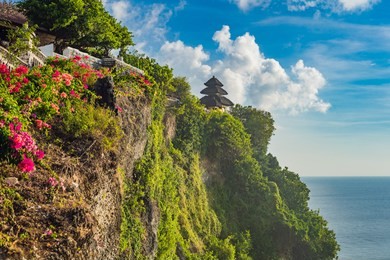 pura luhur uluwatu temple, bali, indonesia. amazing landscape - cliff with blue sky and sea