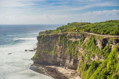 pura luhur uluwatu temple, bali, indonesia. amazing landscape - cliff with blue sky and sea