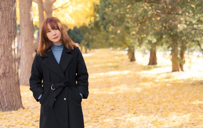 beautiful asian women in the autumn park.