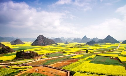 karst landforms and rapeseed flowers, in luoping, yunnan province, china