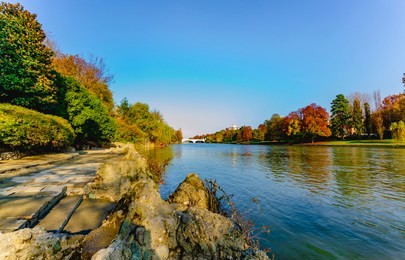 turin, piedmont, italy - november 14, 2018: panorama of the po river from the valentino public park.