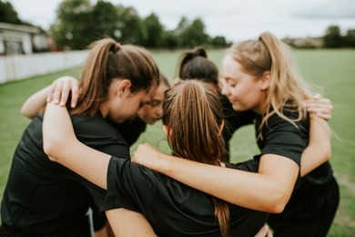 rugby players huddle before a match