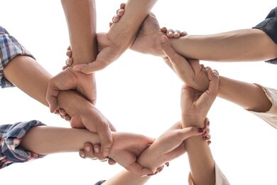 under view friendship people partnership teamwork crossed hands finishing up meeting show unity on white background , business partner  teamwork concept