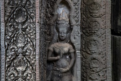 ta prohm angkor wat cambodia. the ancient temple of ta prohm at angkor wat, cambodia where roots of the jungle trees intertwine with the masonry of these ancient structures producing surreal world.