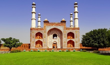 landscape view of the large gate leading the entrance to the tomb of great mughal emperor akbar, at sikandra, agra in uttar pradesh, india