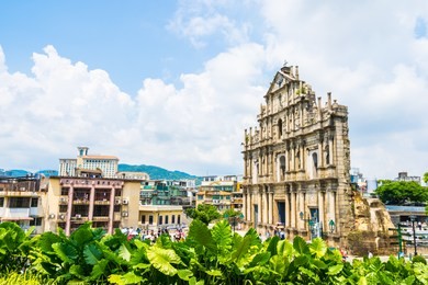 beautiful old architecture building with ruin of st pual church landmark of macau city with blue sky background