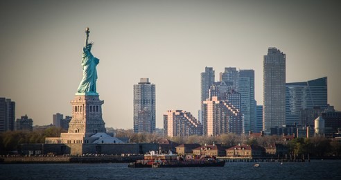 amazing view of the statue of liberty, at sunset