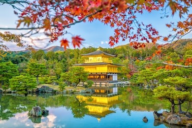 kinkakuji temple in kyoto, japan in autumn at sunset