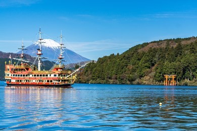 mountain fuji and lake ashi with hakone temple and sightseeing boat in autumn
