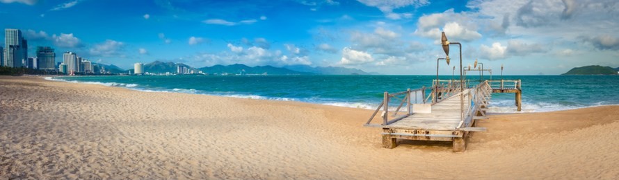  scenic view of nha trang beach at sunny day. beautiful tropical landscape. pier on the foreground. panorama