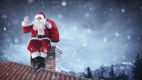 santa claus greeting on roof
