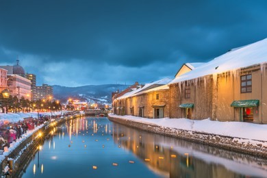 otaru, japan winter skyline on the canals during the twilight light up.