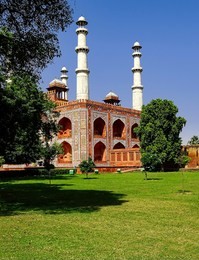 view of the large gate and the minars, from the corner of the magnificent facade of the great mughal emperor, akbar, at agra in uttar pradesh, india