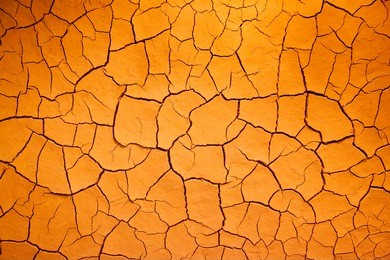 like dry cracked skin this arid earthen background is iron rich