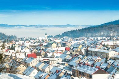 winter in croatia, gorski kotar, town of delnice, panoramic view, houses under snow 