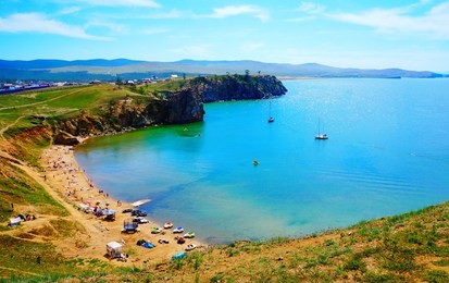 beautiful view on the beach with pristine, blue water of the baikal lake, olkhon island, near irkutsk, buryatia republic, southern siberia, russia, asia