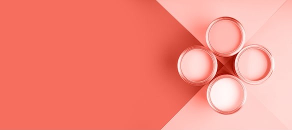 banner with color of the year 2019 - living coral. four open cans of paint on bright symmetry background. place for text. renovation concept.