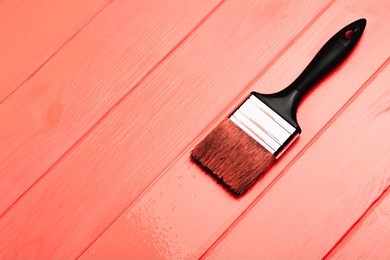 living coral fresh painted wooden board. renovation concept. top view. color of the year 2019. renovation concept.