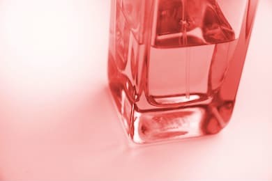 glass glass perfume close up.living coral color of the year 2019. main trend concept