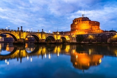 rome, italy: night landscape of the mausoleum of hadrian, usually known as castel sant'angelo (castle of the holy angel), a towering cylindrical building in parco adriano.