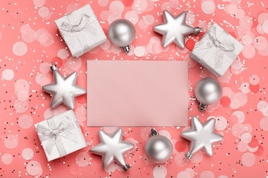 holiday envelope on the background of christmas balls and gifts. greeting card with place for text.