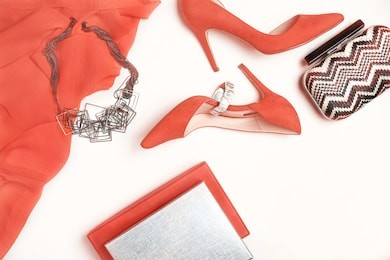 panton color of the year 2019 - living coral. female stylish accessories fashion luxury outfit set: cloth, shoes jewelry. christmas happy new year valentine's day party conception. flat lay, toned
