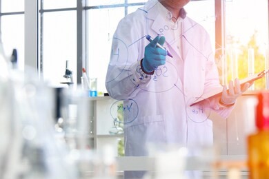 researchers men, interesting chemical work, save important information to the file, and use a transparent glass pen, in the laboratory, full of research equipment.

