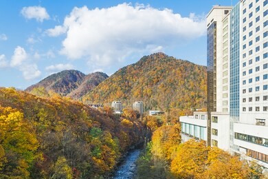 jozankei onsen is located inside shikotsu-toya national park between the high cliffs of the toyohira river. the town is only one hour outside central sapporo.