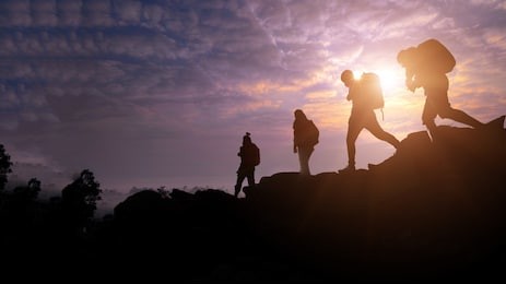 climbing group friends wolking to hike up moutain .teamwork , helps ,success, winner and leadership concept .