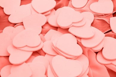 many little hearts, copy space. living coral background. color of the year 2019. wedding, love, valentine day concept