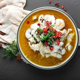 
traditional cooking methods in sichuan, china, pickled fish, pickled sauerkraut, served with chili and fish, very delicious dishes