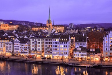 view of zurich old town, switzerland, during christmas time at dusk
