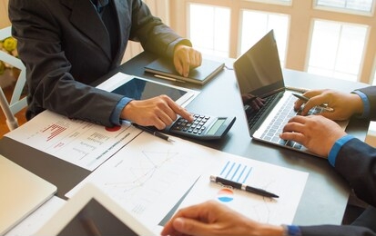 concepts, evaluation and business planning.business consultants are calculating profits and providing financial advice to business owners.