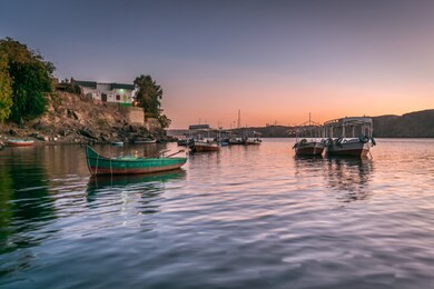 sunset in heisa island ,nile and reflection of boats in aswan egypt